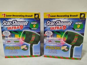 lot 119 image: Two Star Shower Ultra 9 Projection Lamps