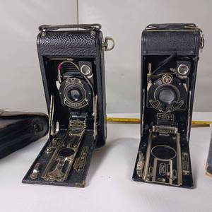 lot 27 image: Two Cameras - No. 2 Folding Cartridge Hawk-Eye Model B, which were produced by Eastman Kodak in the 1920s and 1930s.