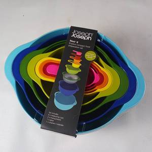 lot 61 image: Joseph Joseph nested bowls and strainer, measuring cups  Brand new