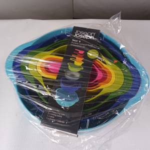 lot 62 image: Joseph Joseph nested bowls and strainer, measuring cups  Brand new
