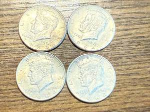 lot 27 image: 4 1964 Kennedy Half Dollars