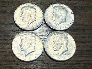 lot 29 image: 4 1964 Kennedy Half Dollars
