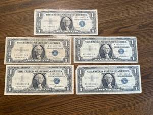 lot 42 image: 5 1957 $1 Blue Seal Silver Certificates