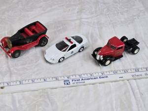 lot 11 image: Toy vehicles including a Tonka vintage car, a Chevrolet police car, and a J.T. Wilson truck