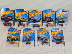 lot 22 image: Hot Wheels Assorted Die-Cast Cars featuring different models and themes such as Netflixs Lets Race, Star Wars, and Minecraft