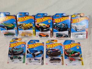 lot 32 image: Hot Wheels Die-Cast Car Collection from different series, such as Hot Wheels Race and Hot Wheels Celebrations,