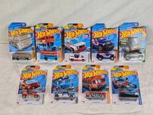 lot 35 image: Hot Wheels Die-Cast Cars including Surfin School Bus, Trouble Decker, Rapid Pulse, and More