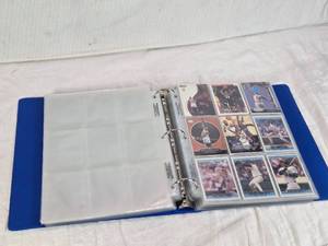 lot 56 image: Binder of Sports Cards Featuring Basketball and Baseball Players Including Michael Jordan and Ken Griffey Jr. Various cards from different sets