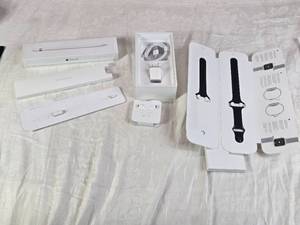 lot 73 image: Apple Pencil Tip, Apple Watch Band, EarPods, and Charging Accessories