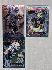 lot 60 image: Lot of 3 Topps Finest Football Cards Featuring Barry Sanders, Dave Brown, and Quentin Coryatt