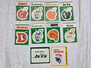 lot 84 image: Lot of NFL Team Stickers Including Chiefs, Seahawks, Browns, Jets, Broncos, Rams, and Oilers