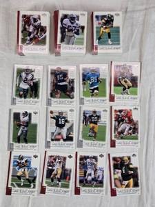 lot 86 image: Large Lot of 2001 Upper Deck Top Tier Football Cards Featuring Key Players Including Peyton Manning, Brett Favre, and Kurt Warner