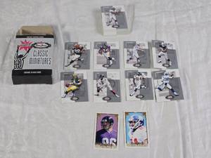 lot 113 image: Lot of Fleer 2002 Box Score Mini NFL Trading Cards Featuring Brett Favre, Peyton Manning, and Jerry Rice