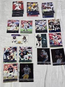lot 116 image: Early 2000s Playoff Prestige Football Cards Featuring Jerry Rice, Kurt Warner, Emmitt Smith, and Donovan McNabb