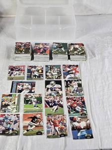 lot 117 image: Large Lot of Early to Mid 90s Topps Football Cards Featuring Emmitt Smith, Drew Bledsoe, and John Elway Including Plastic Case