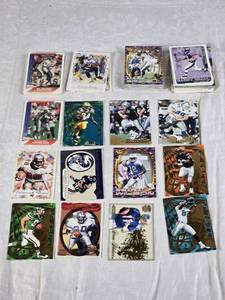 lot 121 image: Lot of Late 90s and Early 2000s Pacific Football Cards Featuring Barry Sanders, Drew Bledsoe, and Others