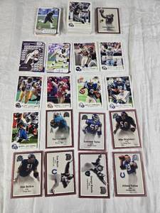 lot 126 image: Lot of 19992002 Fleer Focusa & Greats of the Game Football Cards Featuring Peyton Manning, Randy Moss, and Johnny Unitas