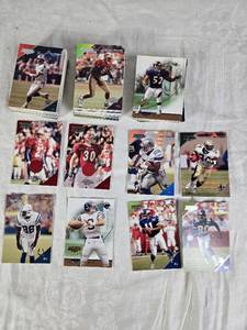 lot 129 image: Topps Debut 2001 Football Cards Featuring Ray Lewis, Emmitt Smith, Chris Carter, and Ricky Williams & Tay Goody Relic, Dustin McClintock Relic