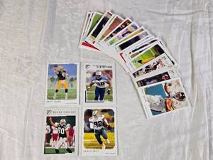 lot 132 image: Lot of 4 Football Cards Featuring Brett Favre, Emmitt Smith, Wayne Chrebet, and Jevon Kearse