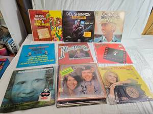 lot 142 image: Variety of vinyl records featuring notable country and pop artists such as Sam & Kirk McGee, Del Shannon, Carl Smith, Mel Tillis, Marty Robbins, The Carpenters, Johnny Duncan, Mickey Gilley, Charlie Rich, and The Country Ramblers