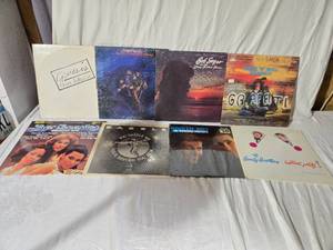 lot 162 image: Lot of Vinyl Records Featuring Genesis, Bob Seger, and More
