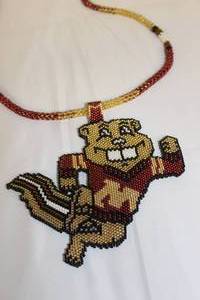 lot 92 image: Hand Beadwork Medallion and Neckles