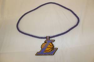 lot 95 image: Hand Beadwork Medallion and Neckles