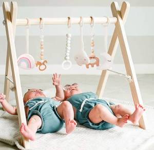 lot 104 image: Wooden Baby Play Gym with Toys - Brand New