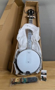 lot 131 image: Banjo 4 String Magic Gold with Strap and Tuner $85.99 Retail - Brand New