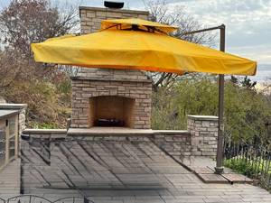 lot 60D image: OP - 10 Foot Patio Umbrella with Worn Yellow Cover and New Red Canopy Included