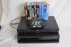 lot 124 image: Daewoo DVD Player, RCA VHS Player, and 10 Movie Collection