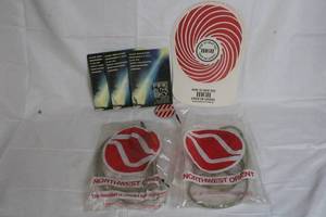 lot 151 image: Northwest Orient Airlines Skyshow Headsets, Button, and Fire in the Sky Memorabilia Set