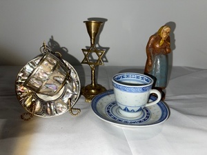 lot 211 image: Eclectic Decor Collection with Brass Star Candle Holder, Abalone Trinket Box, Porcelain Teacup, and Figurine