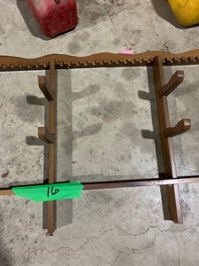 lot 16 image: Gun rack, decorations, lawn chairs