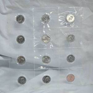 lot 16 image: 1867-1992 Silver Canadian 25c State Coin Set Set Sheet, UNC, 12 quarters