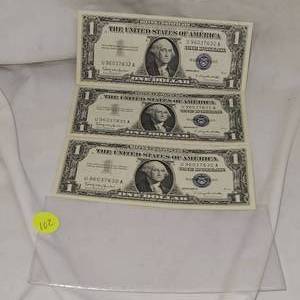 lot 102 image: 1957B, 3 Consecutive $1 Silver Certificate, BU Condition