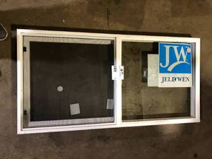 lot 42 image: V20012 - Andersen series 200 Double-Hung Clad Wood Window with White Interior Low-E Glass White customer return see pictures