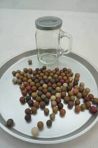 lot 15 image: .90lbs Antique Clay Marbles.