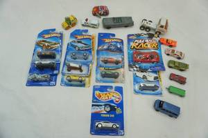 lot 56 image: Tootsie Toys, Wind-Up Tin Car, Hot Wheels New in Packaging.