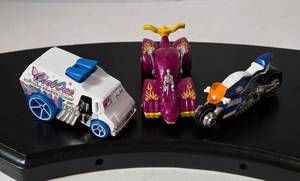 lot 82 image: HotWheels CoolOne Van, Canyon Carver Police Bike, Knight Draggin