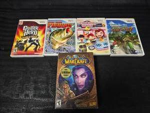 lot 96 image: (4) Wii Games and World of Warcraft Game