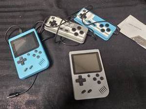 lot 124 image: (2) Mini Game Consoles with Hand Controllers