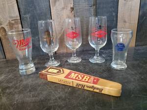 lot 24 image: Nice Collection of vintage Beer Glasses and One Tapper Handle Grainbelt, PBR, and more