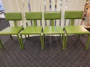 lot 5 image: A set of 4 Maria Yee Chairs.