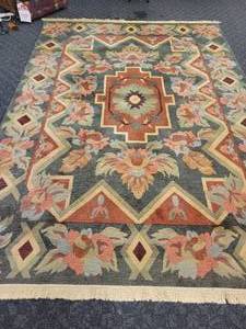 lot 13 image: 8 x 11 wool area rug.