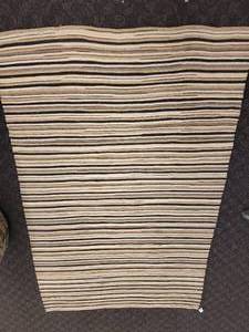 lot 16 image: An 8 x 10 wool rug made by Surya.