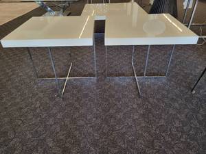 lot 57 image: A pair of white side tables with chrome legs by A.L.F. Italy.