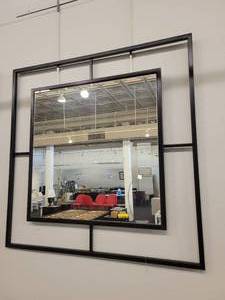 lot 64 image: Black Iron Framed Wall Mirror with a Windowpane Design.