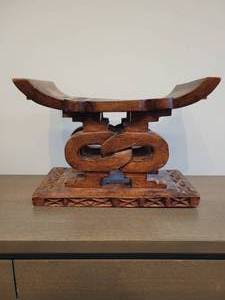 lot 79 image: An African Ashanti Stool. Knotted design.