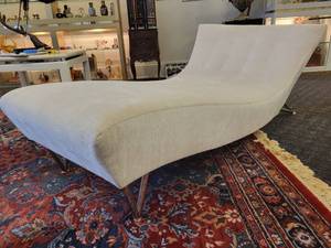 lot 104 image: A Modern Chaise Lounge with Chrome Legs by Lazar.
